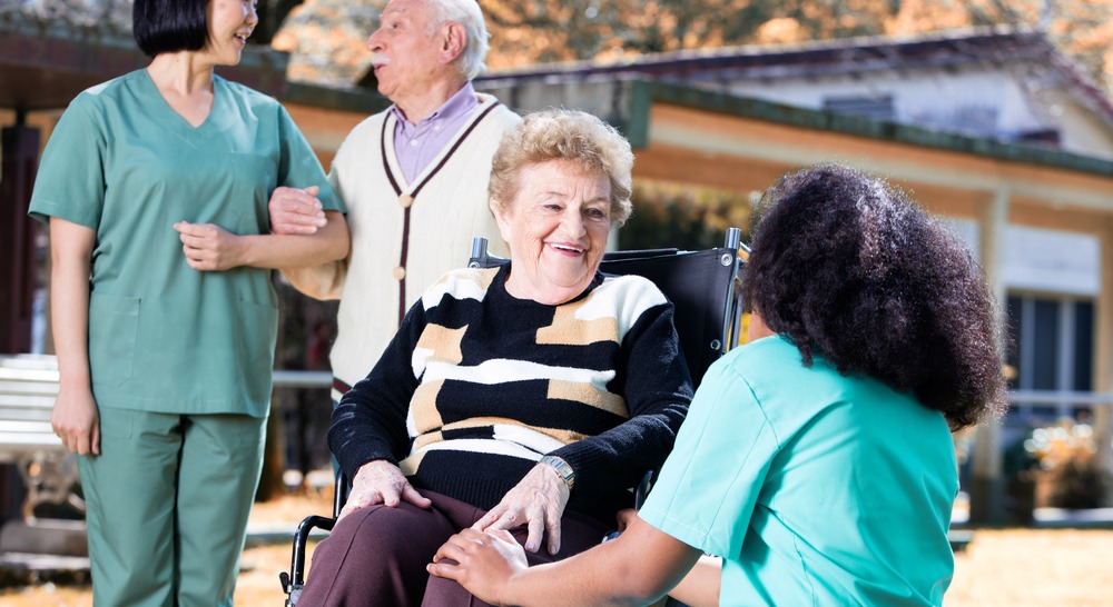 Memory care personnels assisting seniors