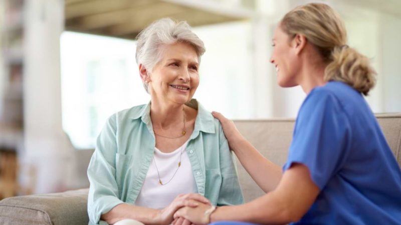 Health care provider having a conversation with the elder woman Health care provider having a conversation with the elder woman.