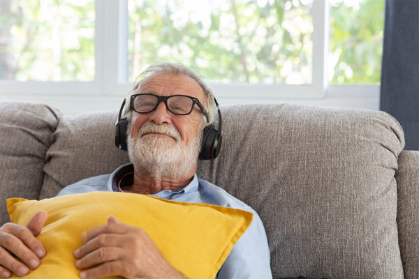 Senior man listening to music.