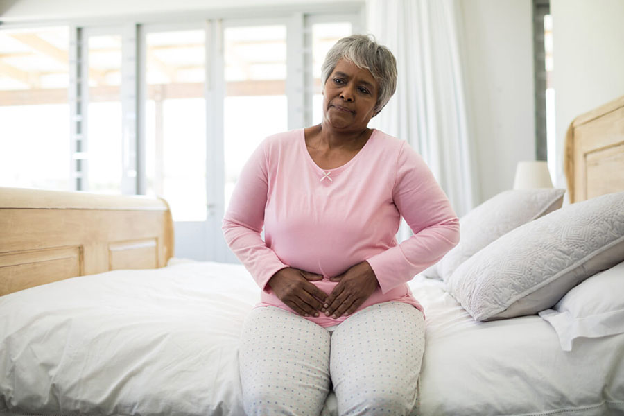 Senior woman suffering from UTI concept image for can a UTI Cause Memory Loss