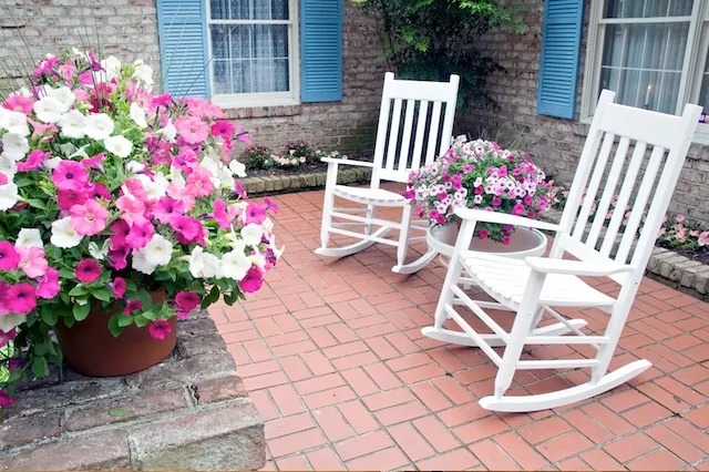 Rocking chairs arranged outdoors at our assisted living facility in Willards, Maryland, providing a serene space for relaxation and conversation.