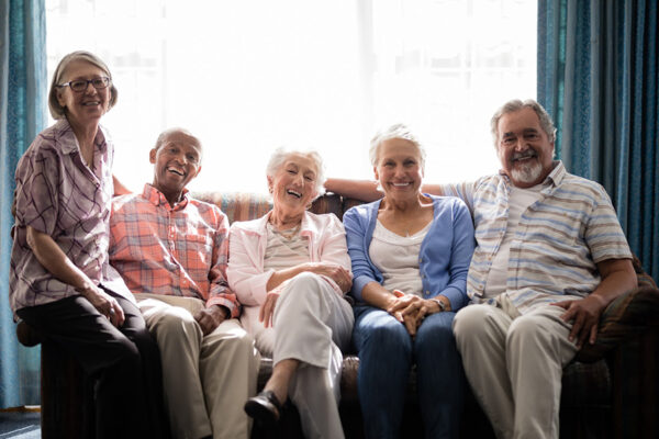 Group of happy couples that feel satisfied with Catered Living after searching many facilities for memory care options