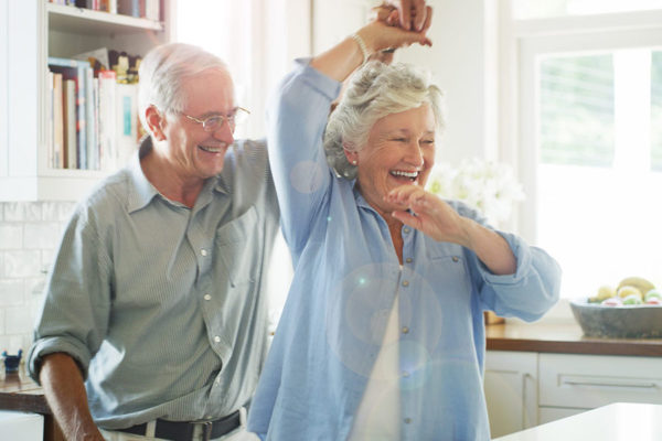 Senior couple dancing together concept image for independent living
