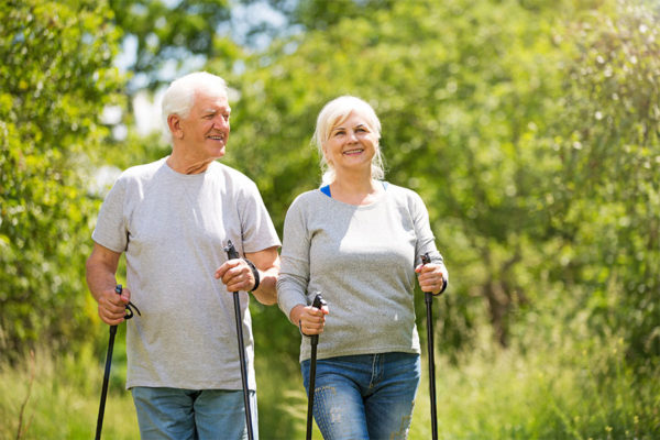 Senior couple walking together improving their quality of life.