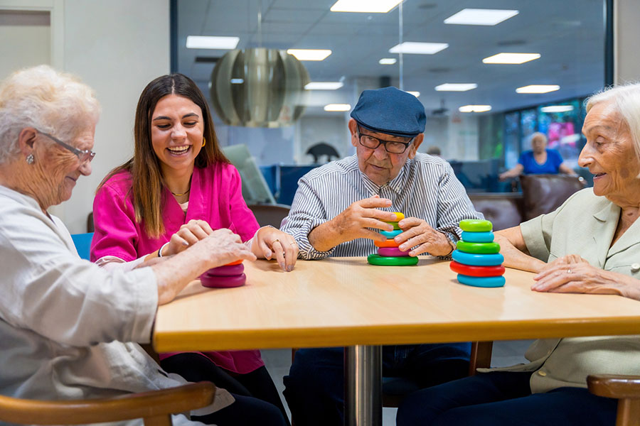 Seniors enjoying social interaction and daily assistance during a temporary short-term residential stay.